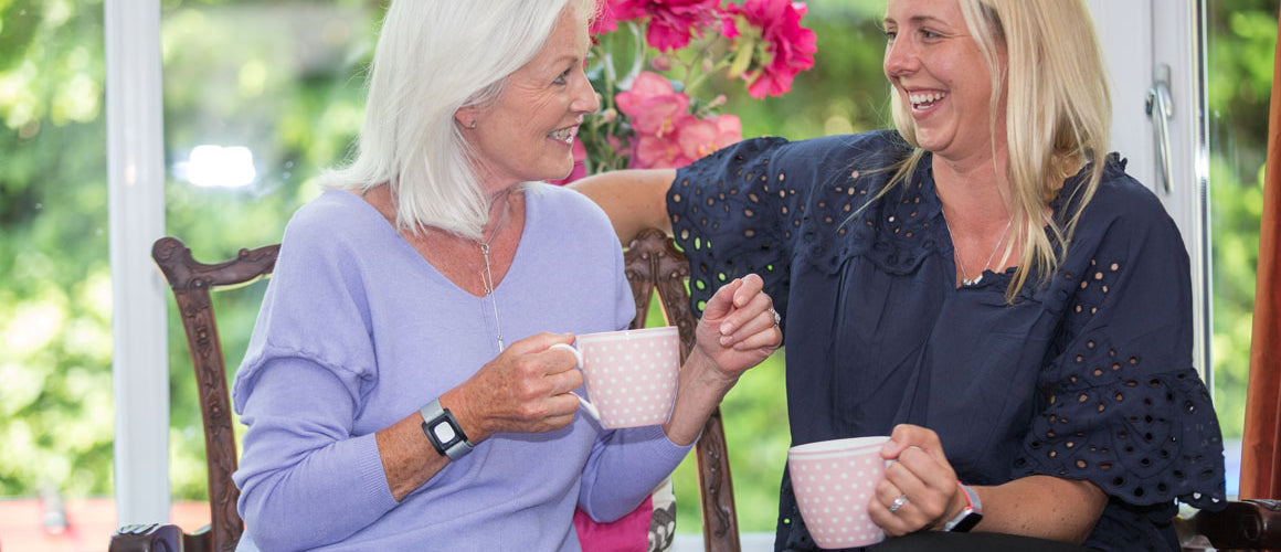 Daughter talking to elderly mother