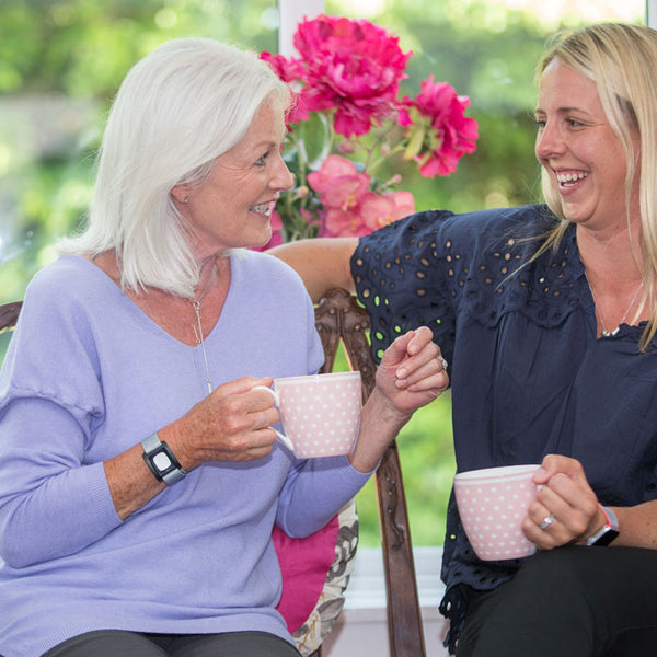 Daughter talking to elderly mother