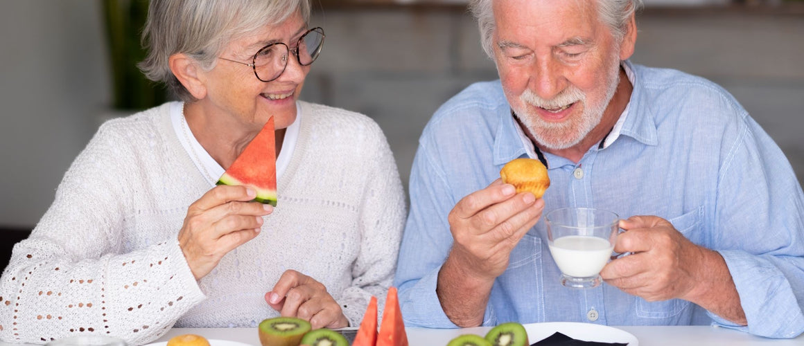 Elderly couple having healthy snacks