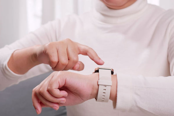 Elderly woman with her Apple watch