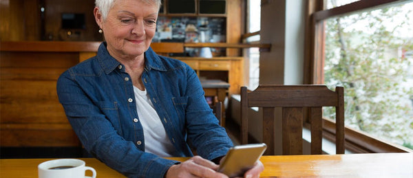 Elderly woman using mobile phone