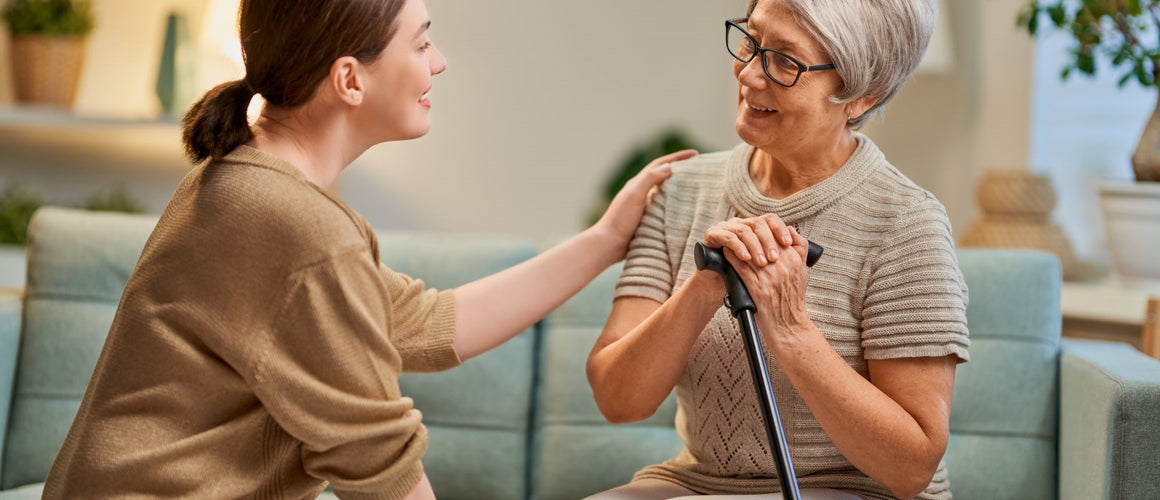Happy elderly holding hands with relative