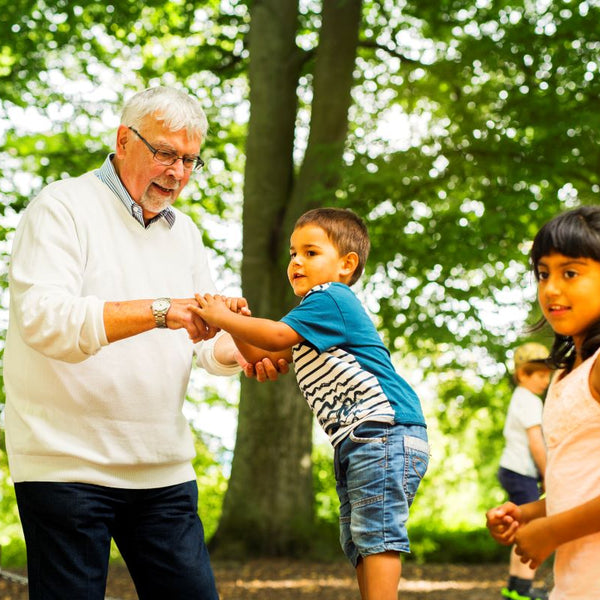 elderly grandfather with grandkids