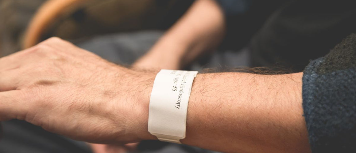 Elderly with a medical bracelet with her medical information on it