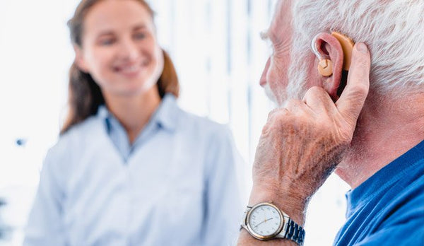 Old man with hearing problems
