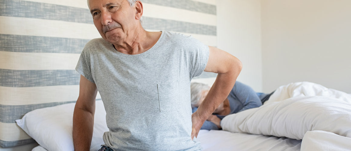 Elderly man with sciatica back pain