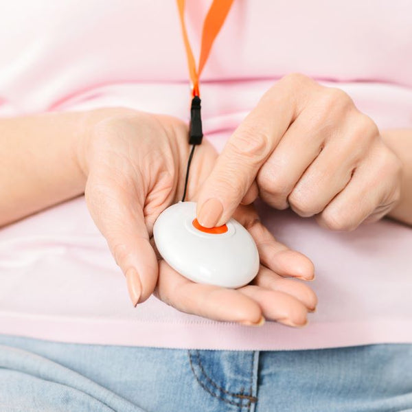 Women pressing her waterproof personal alarm