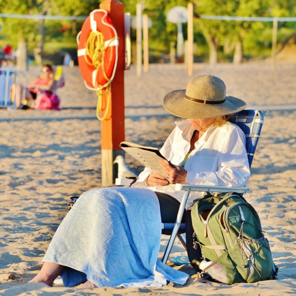 Elderly woman at the beach