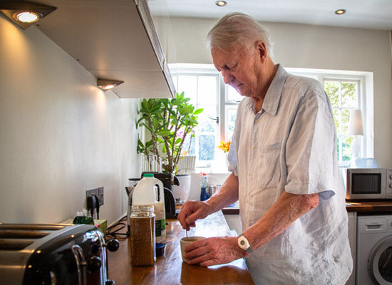 Elderly man with in home alarm