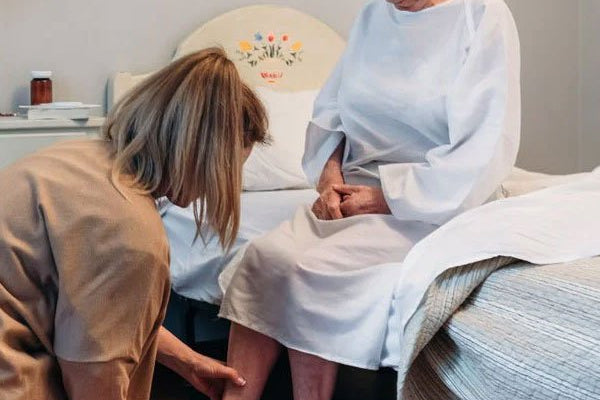 Daughter caring for hospitalized elderly mother