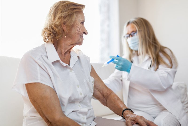 Senior getting a flu jab