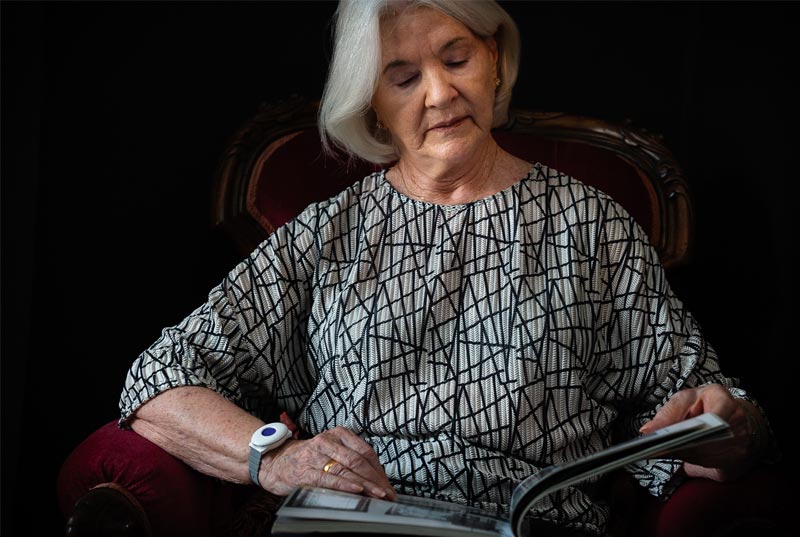 Elderly lady against dark background