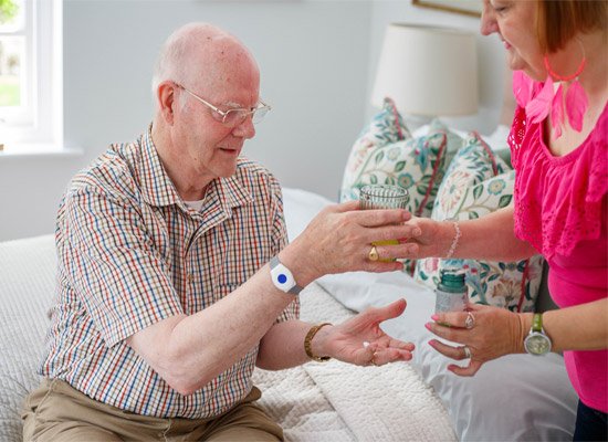 Man wearing single button personal alarm
