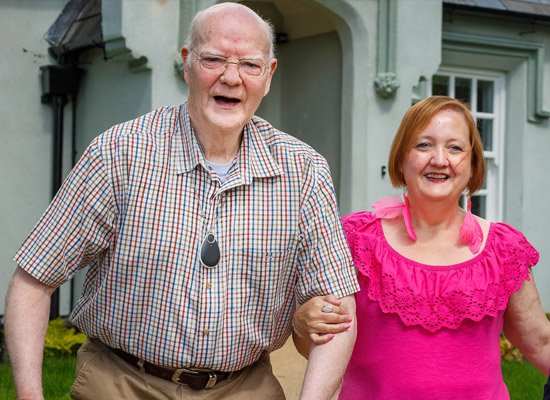 Elderly man with relative outside