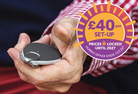 Elderly GPS tracker held in hand