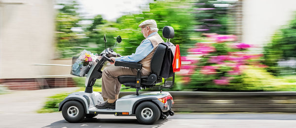 Elderly man in motorised wheelchair
