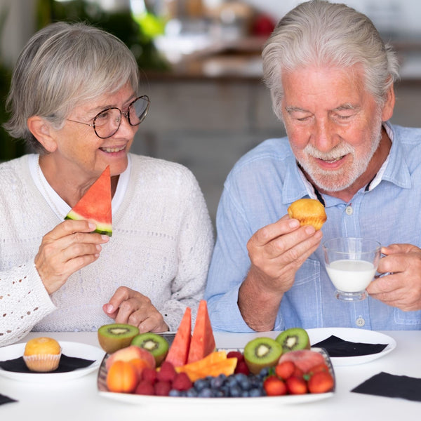 Elderly couple having healthy snacks