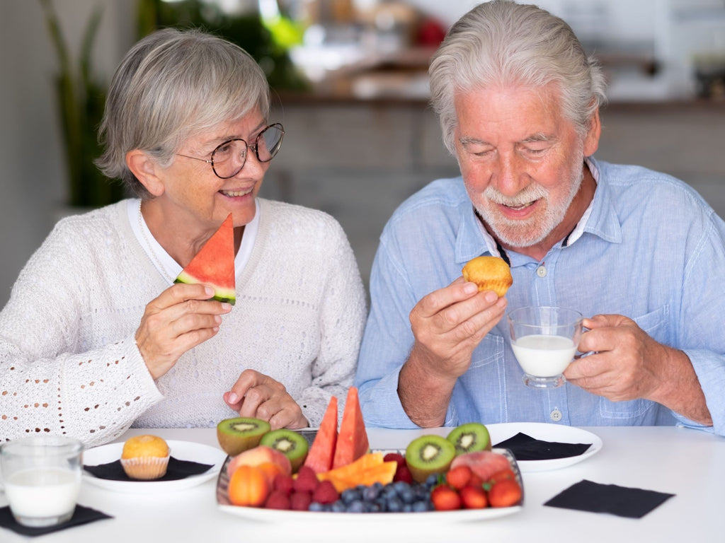Elderly couple having healthy snacks