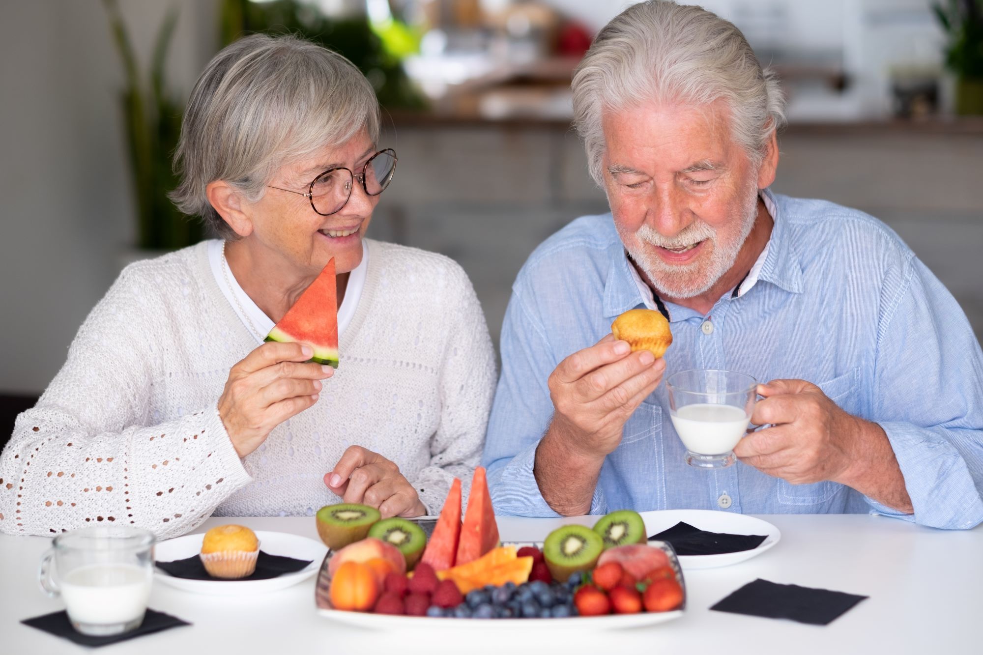 Elderly couple having healthy snacks