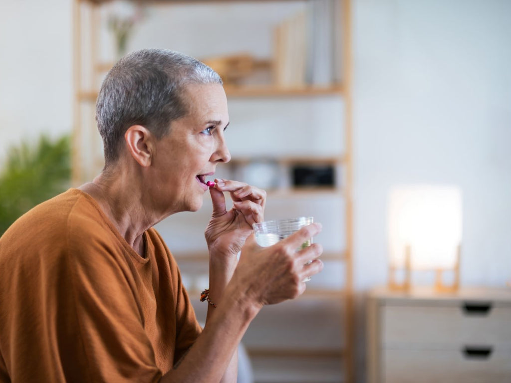 elderly woman taking her medicines