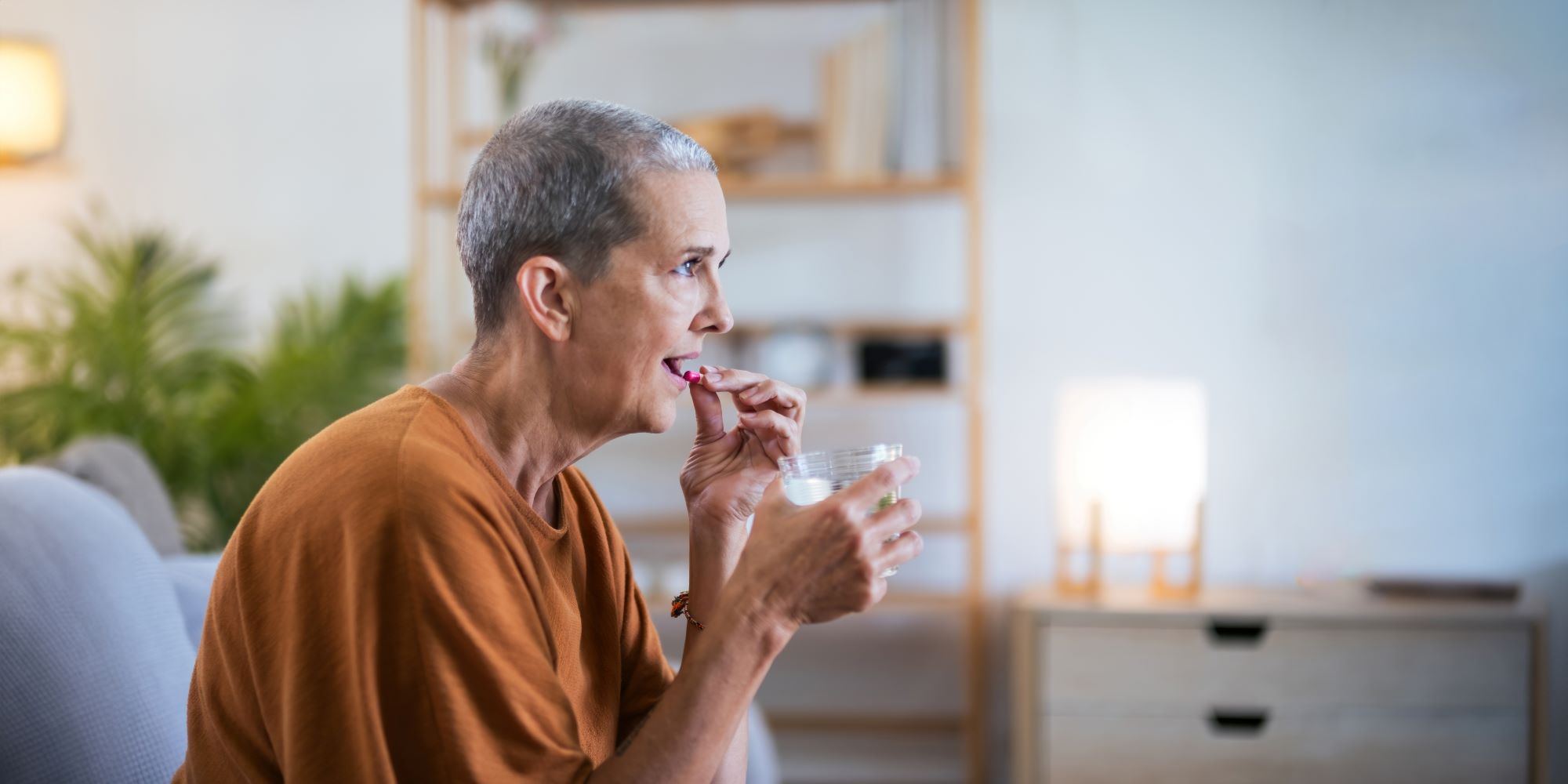 elderly woman taking her medicines
