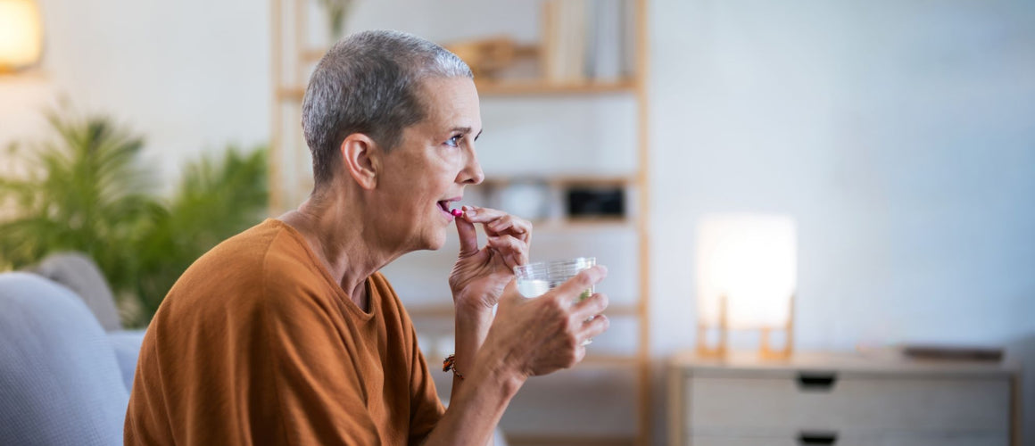 elderly woman taking her medicines
