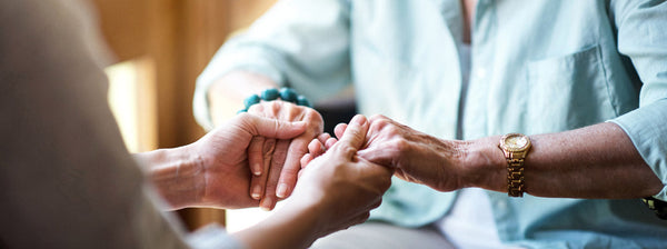 Daughter talking to elderly parent