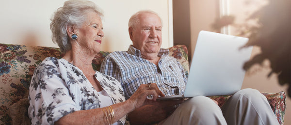 Elderly couple looking at finances online