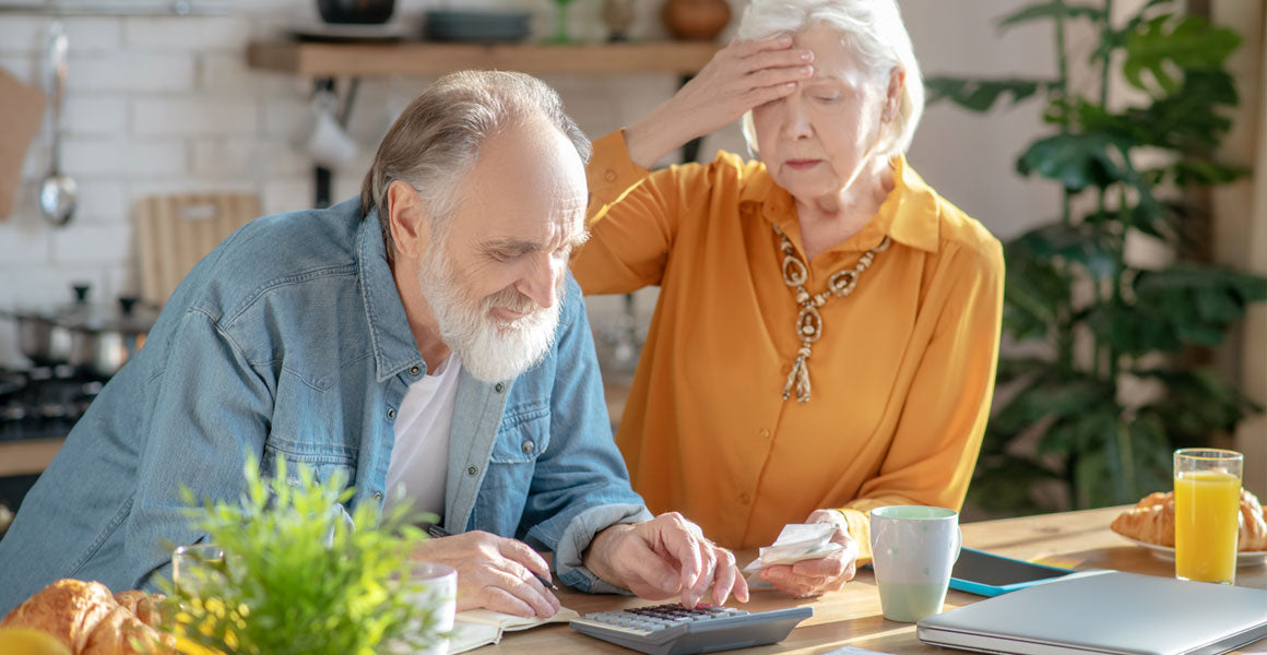 Elderly couple looking at finances