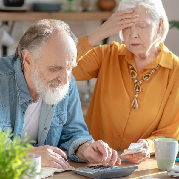 Elderly couple looking at finances
