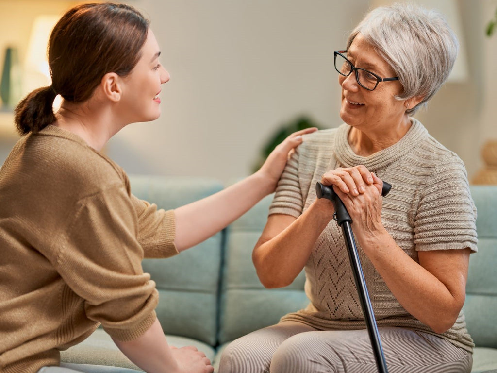 Happy elderly holding hands with relative