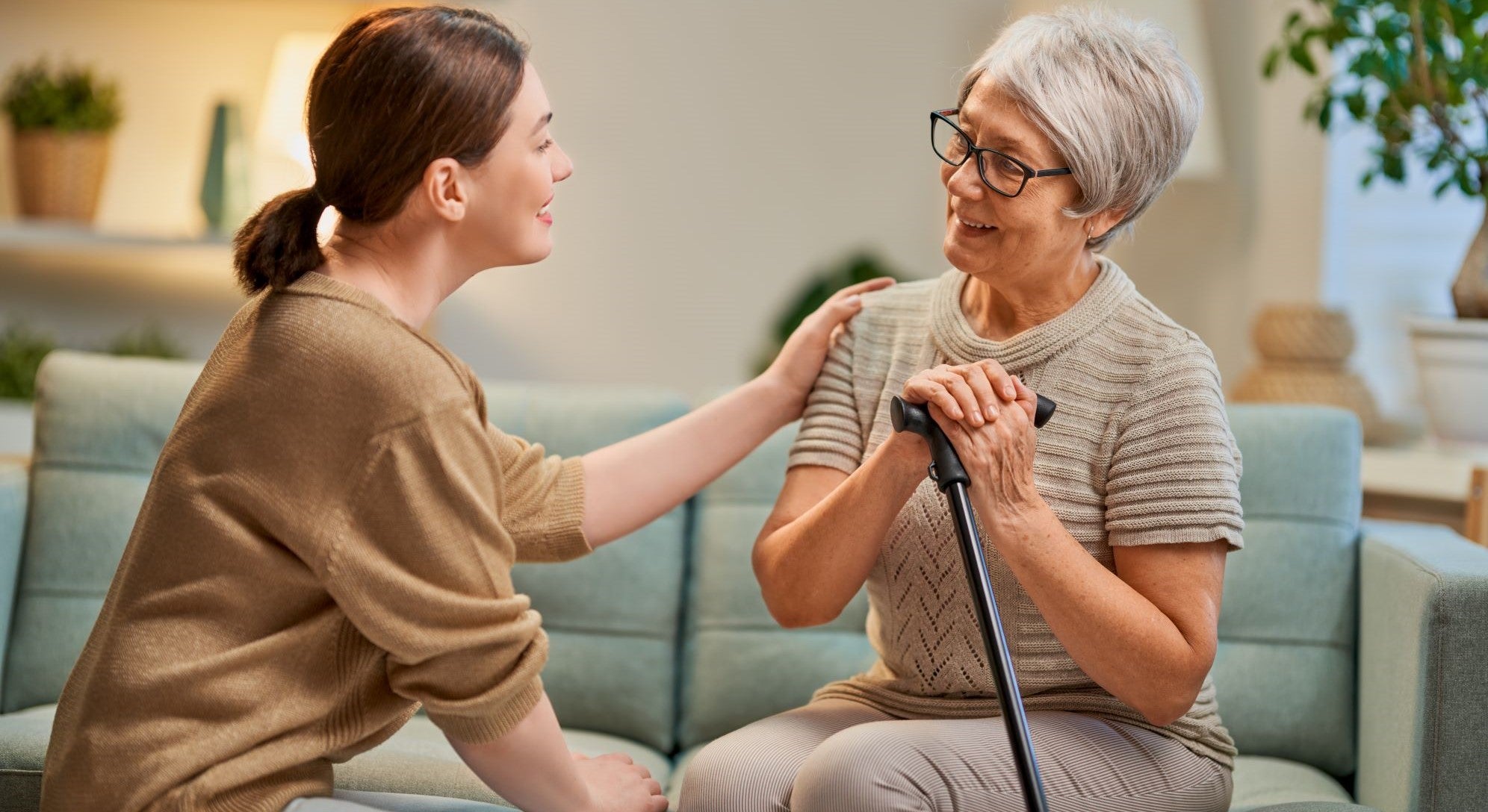 Happy elderly holding hands with relative