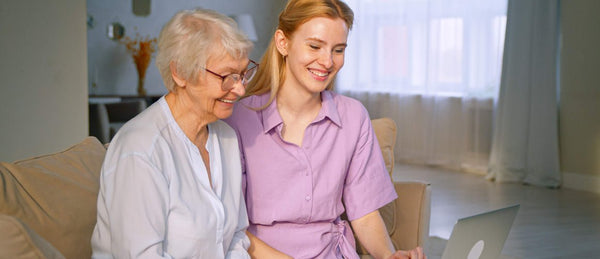 daughter spending time with elderly mother