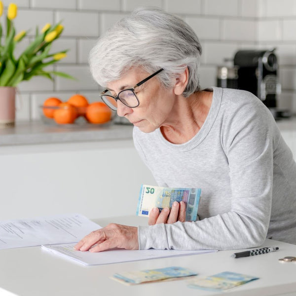 Elderly woman checking her pension credit