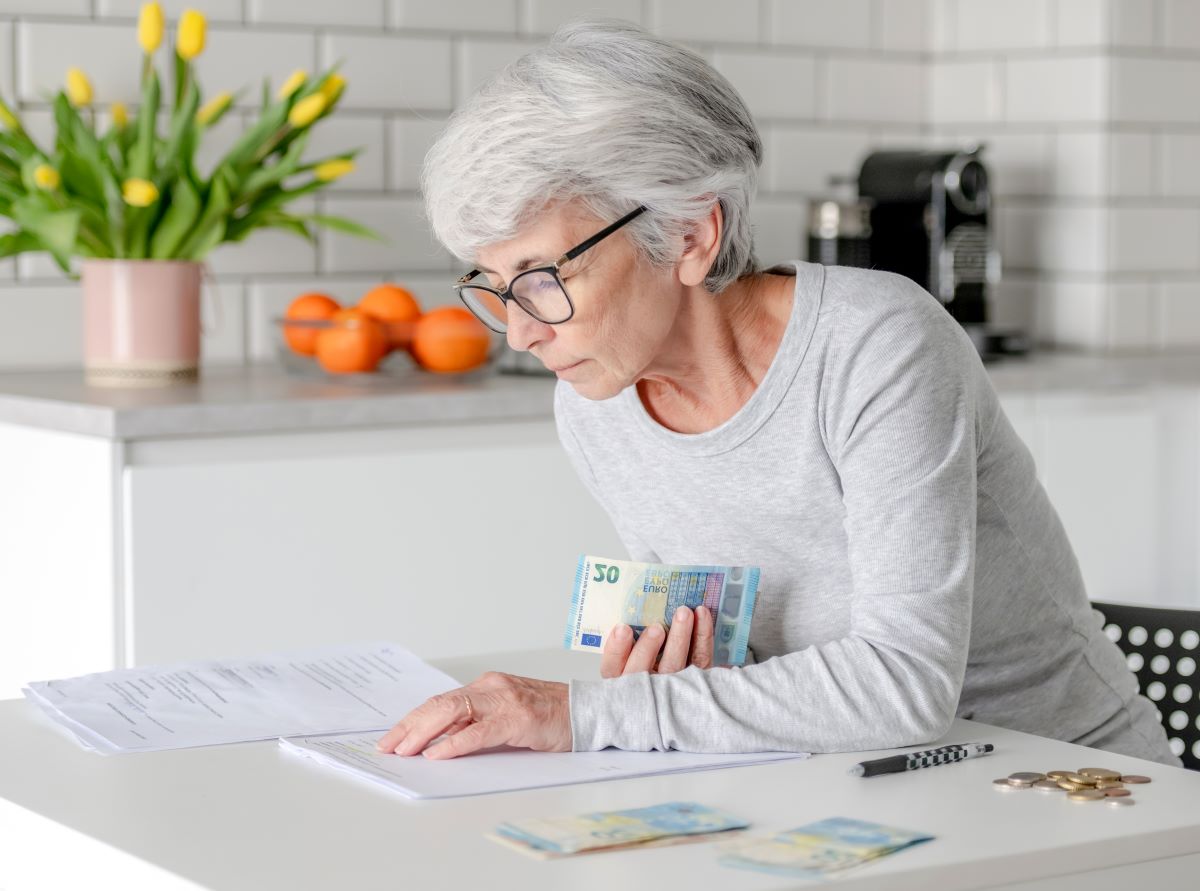 Elderly woman checking her pension credit