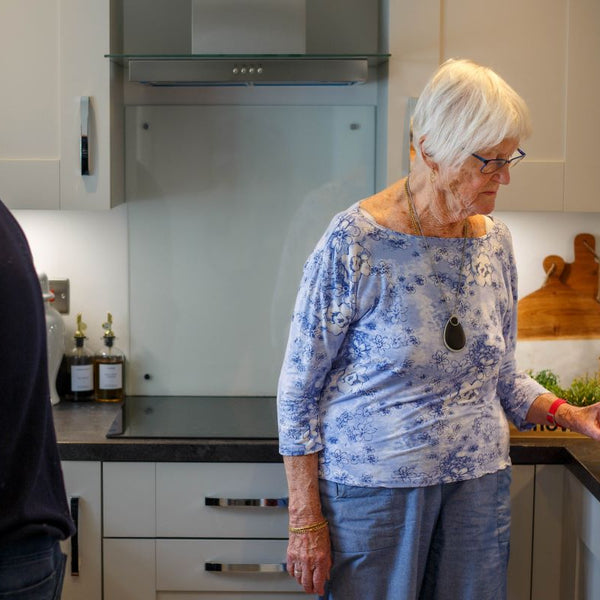 Elderly woman with her personal alarm keyring