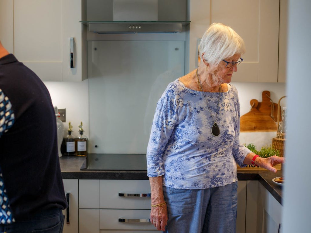 Elderly woman with her personal alarm keyring