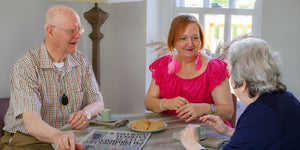 Elderly couple with personal alarms that contact family and friends