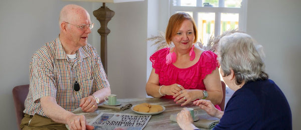 Elderly friends with a personal alarm