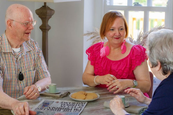 Elderly friends with a personal alarm