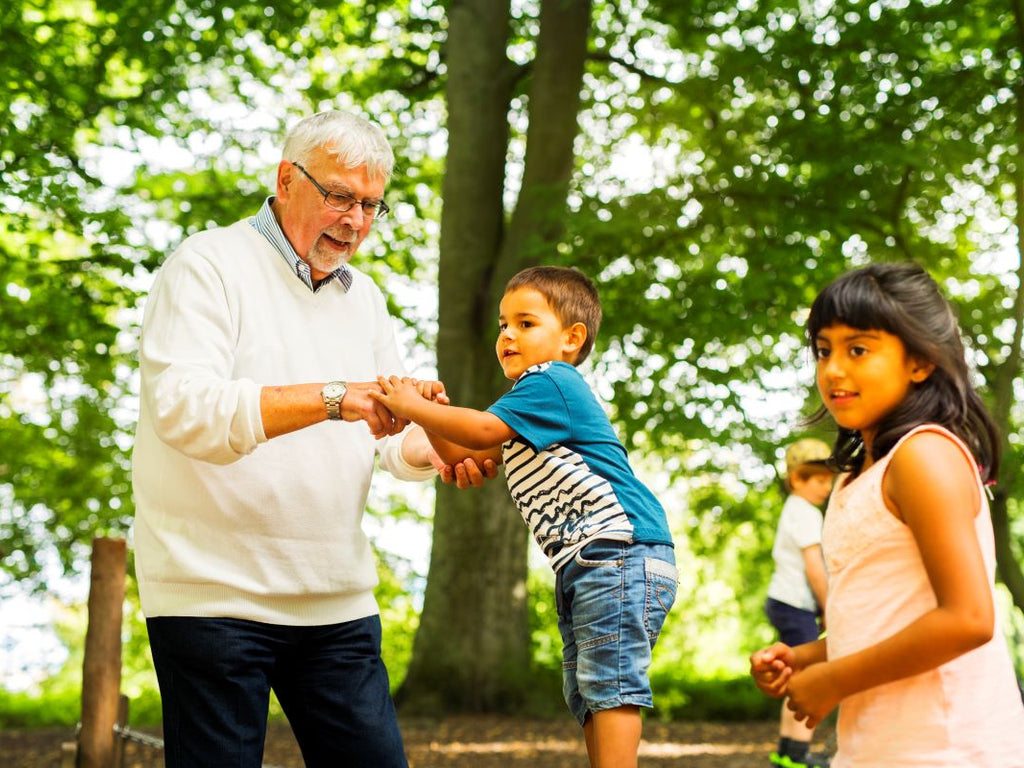 elderly grandfather with grandkids