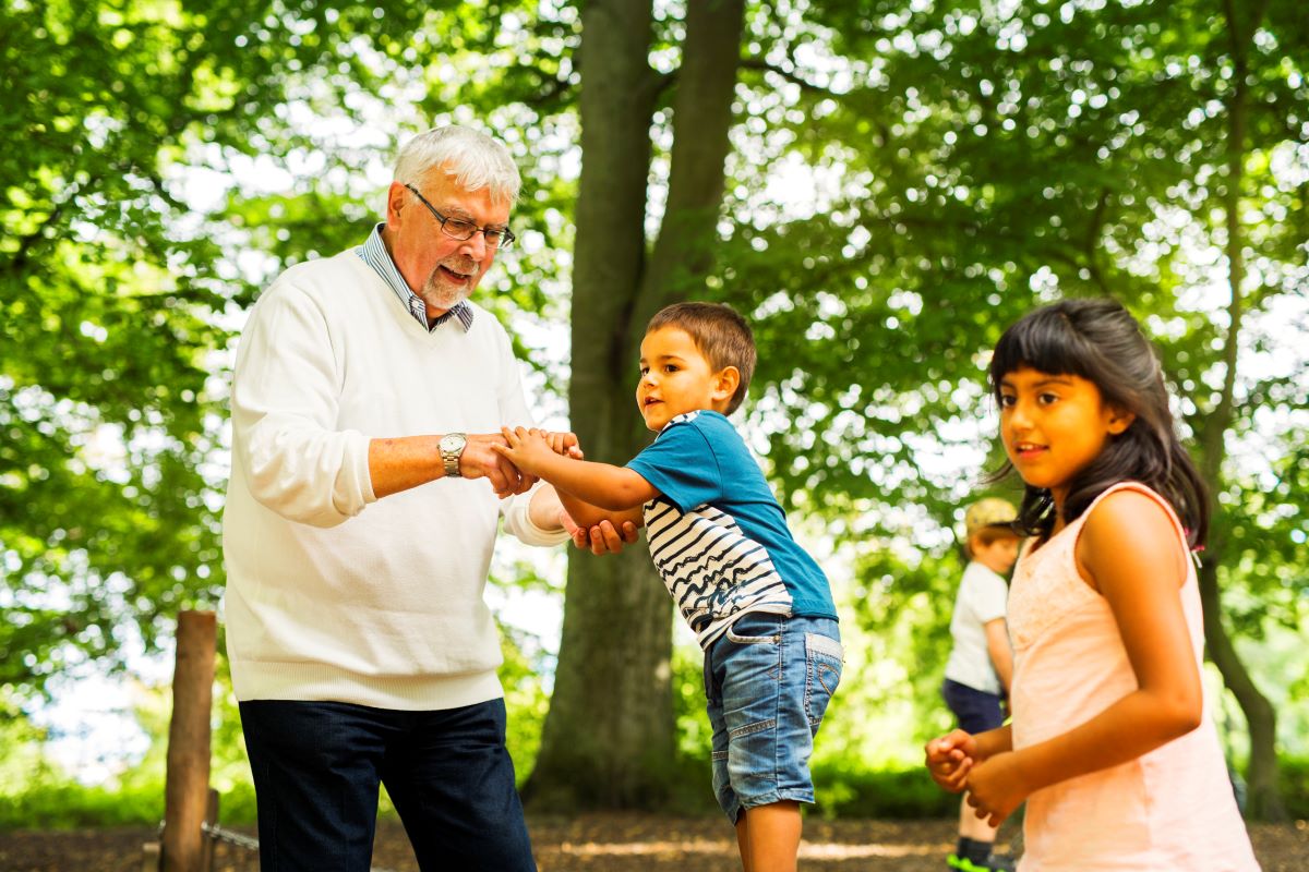 elderly grandfather with grandkids