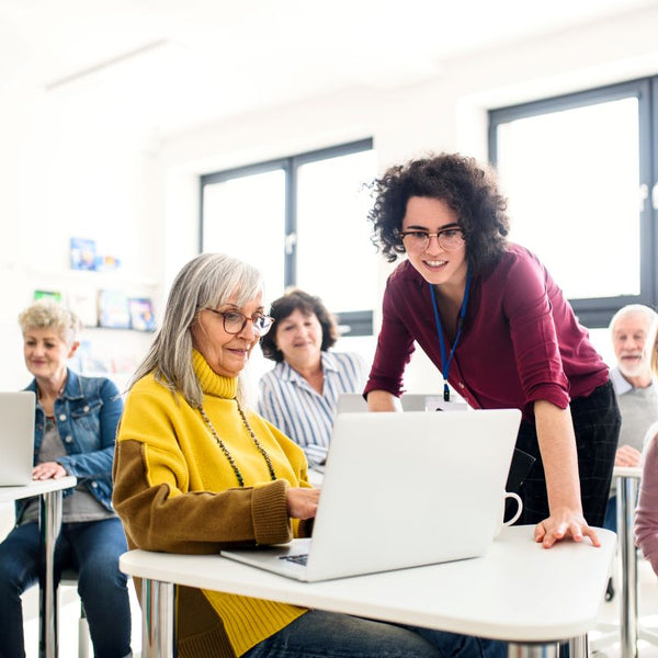 Elderly learning in a classroom