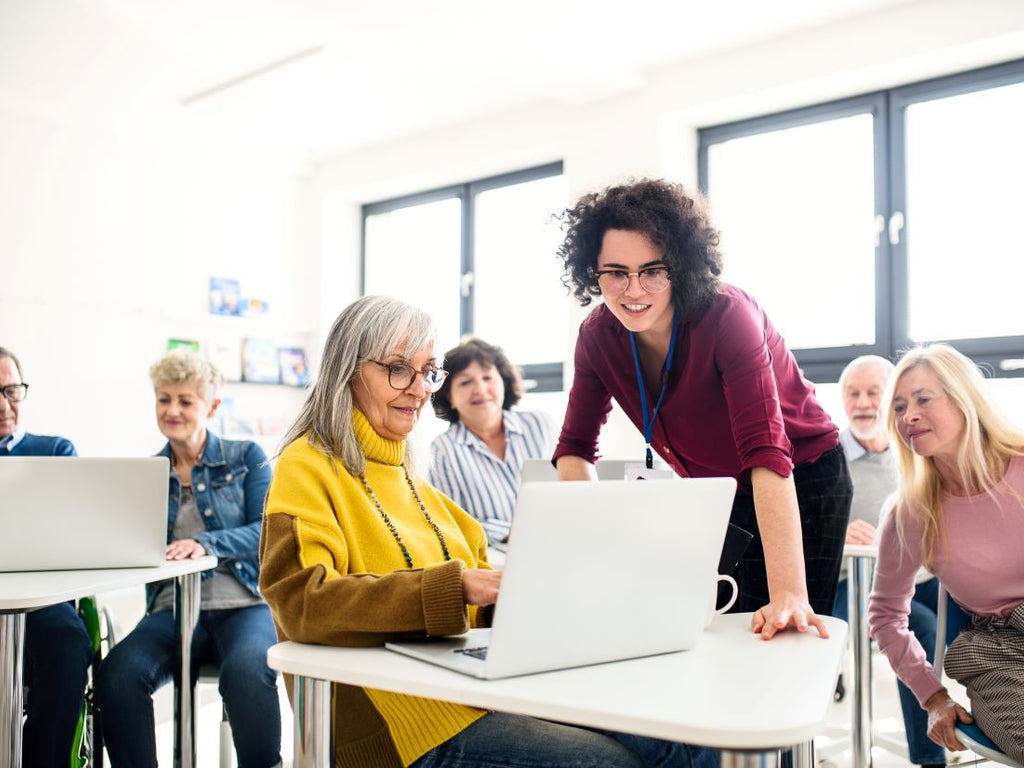 Elderly learning in a classroom