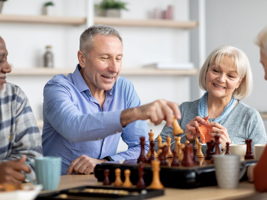 Elderly playing brain games while sitting down