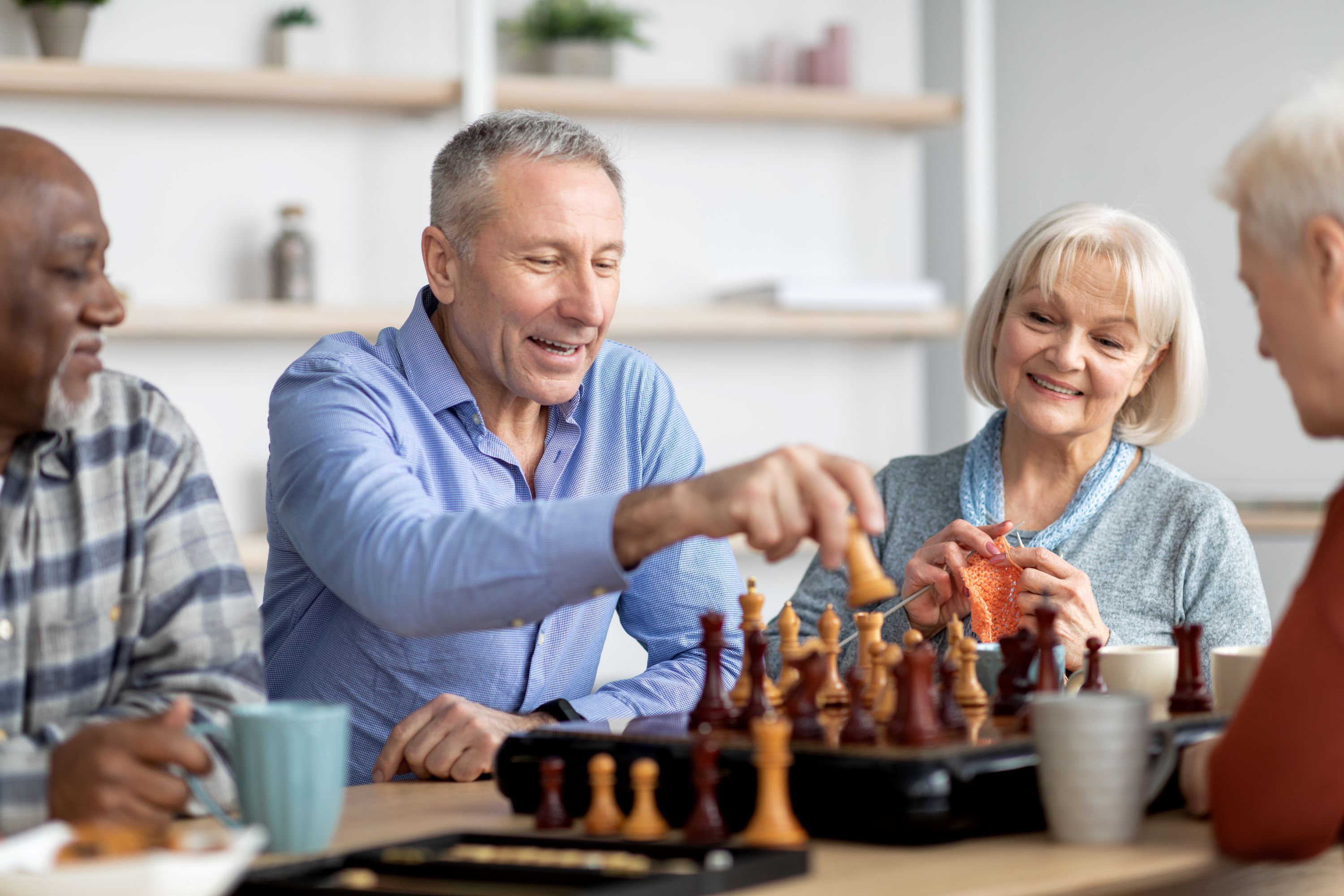 Elderly playing brain games while sitting down