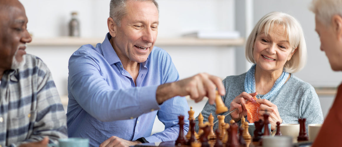 Elderly playing brain games while sitting down