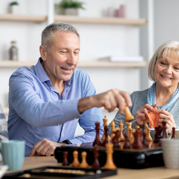 Elderly playing brain games while sitting down