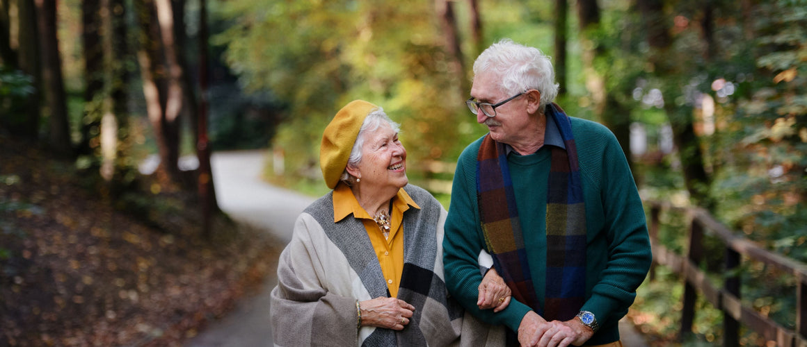 Older couple on a walk in warm clothes