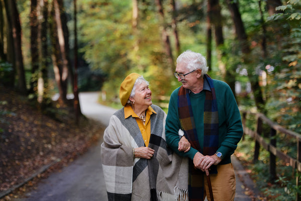 Older couple on a walk in warm clothes